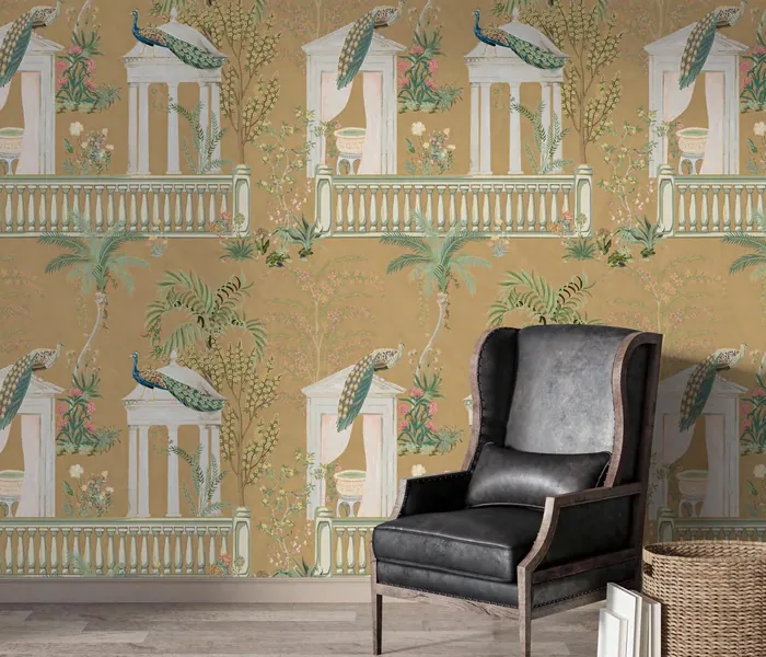Reading corner with an ochre peacock-arch wallpaper and a leather armchair