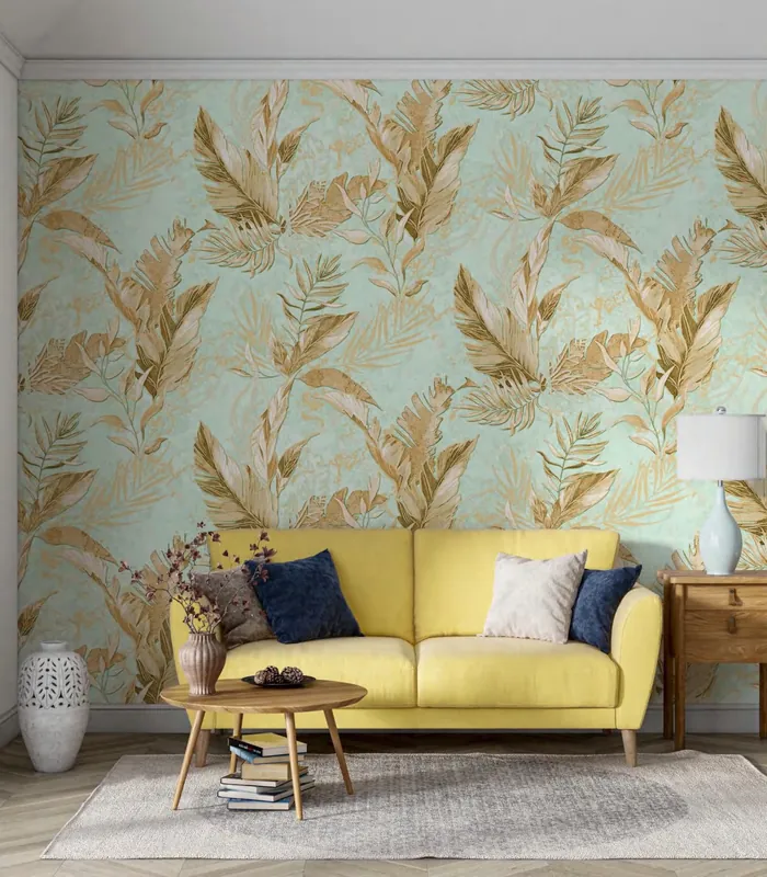 Living room with a golden leaf wallpaper on mint and a yellow sofa